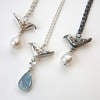 Bird necklaces with gems and pearls